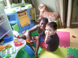 Children in play kitchen