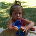 Child playing with water playset